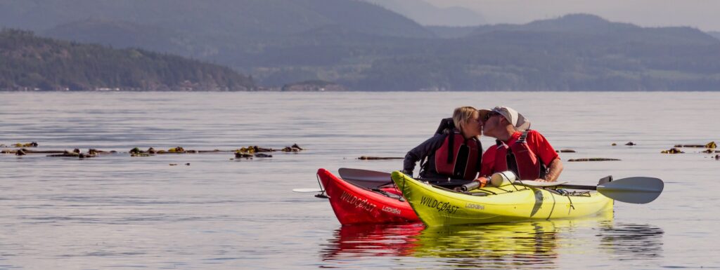 two people in a kayak on the water