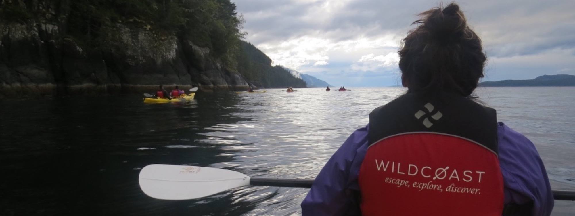 a person in a canoe paddling on the water