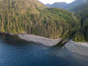 Orca Camp from a birdseye view, overlooking camp, the mountains behind and the creek