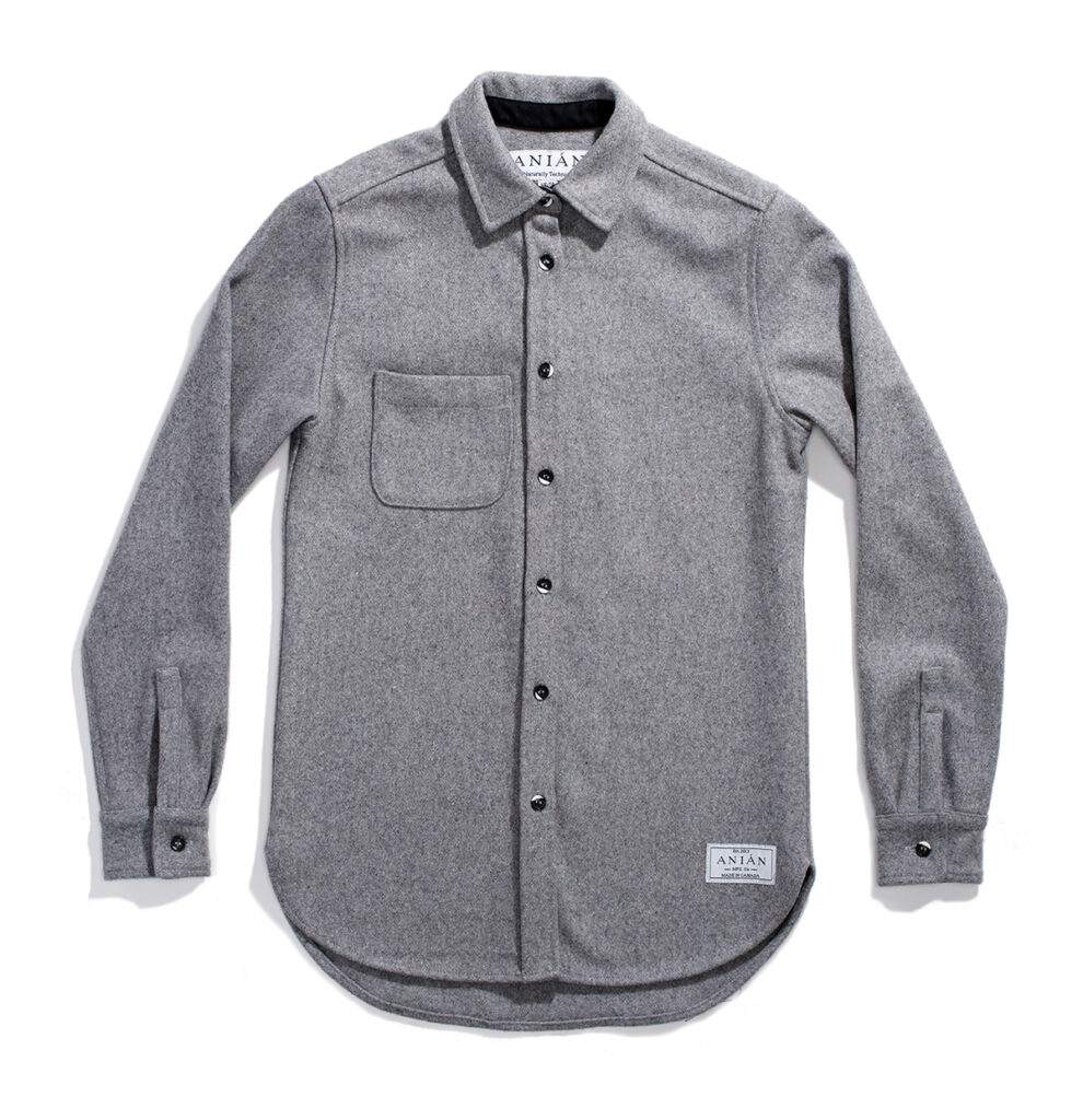 a gray shirt with a white label on the chest