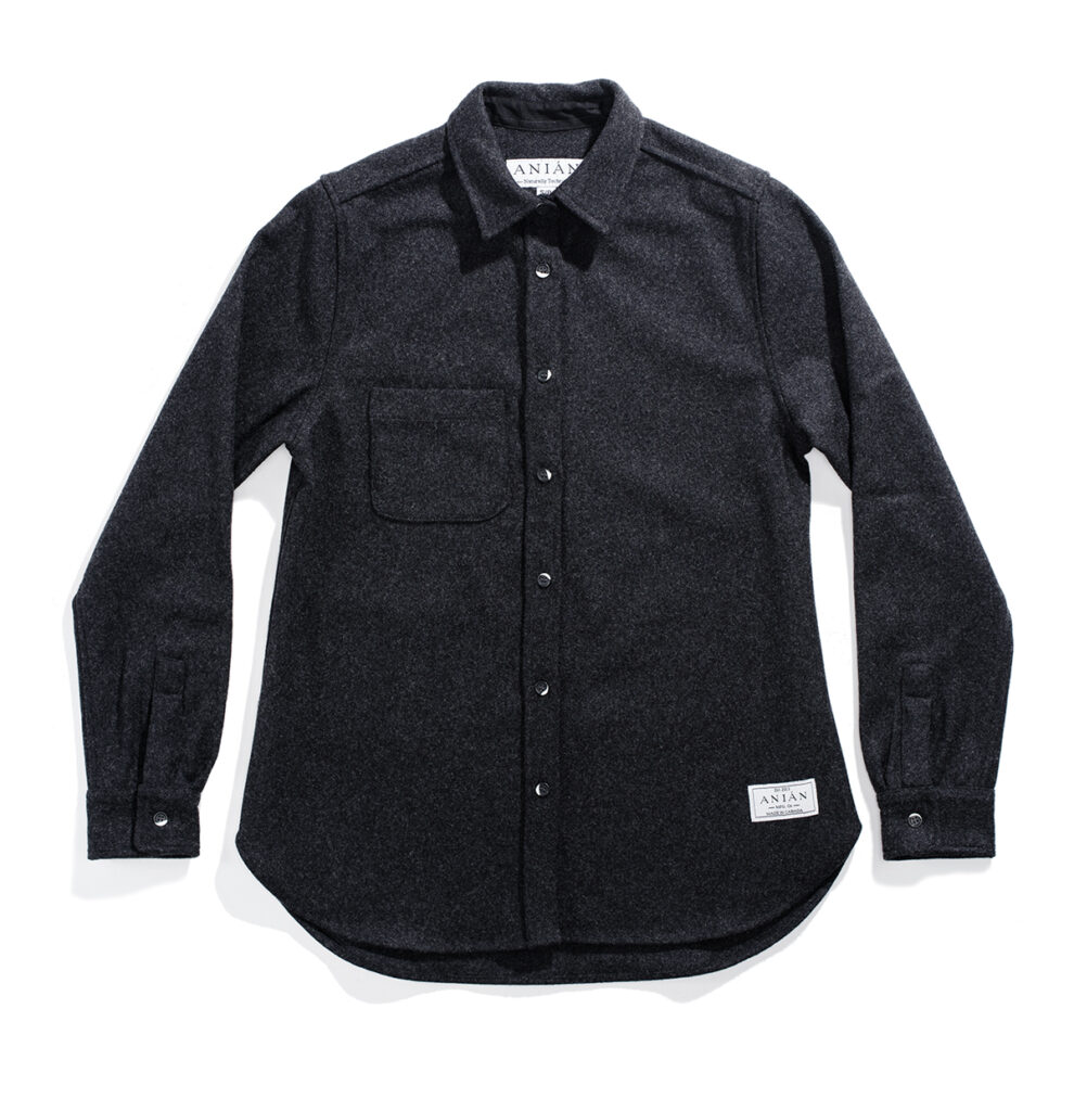 a black shirt with a white label on the chest