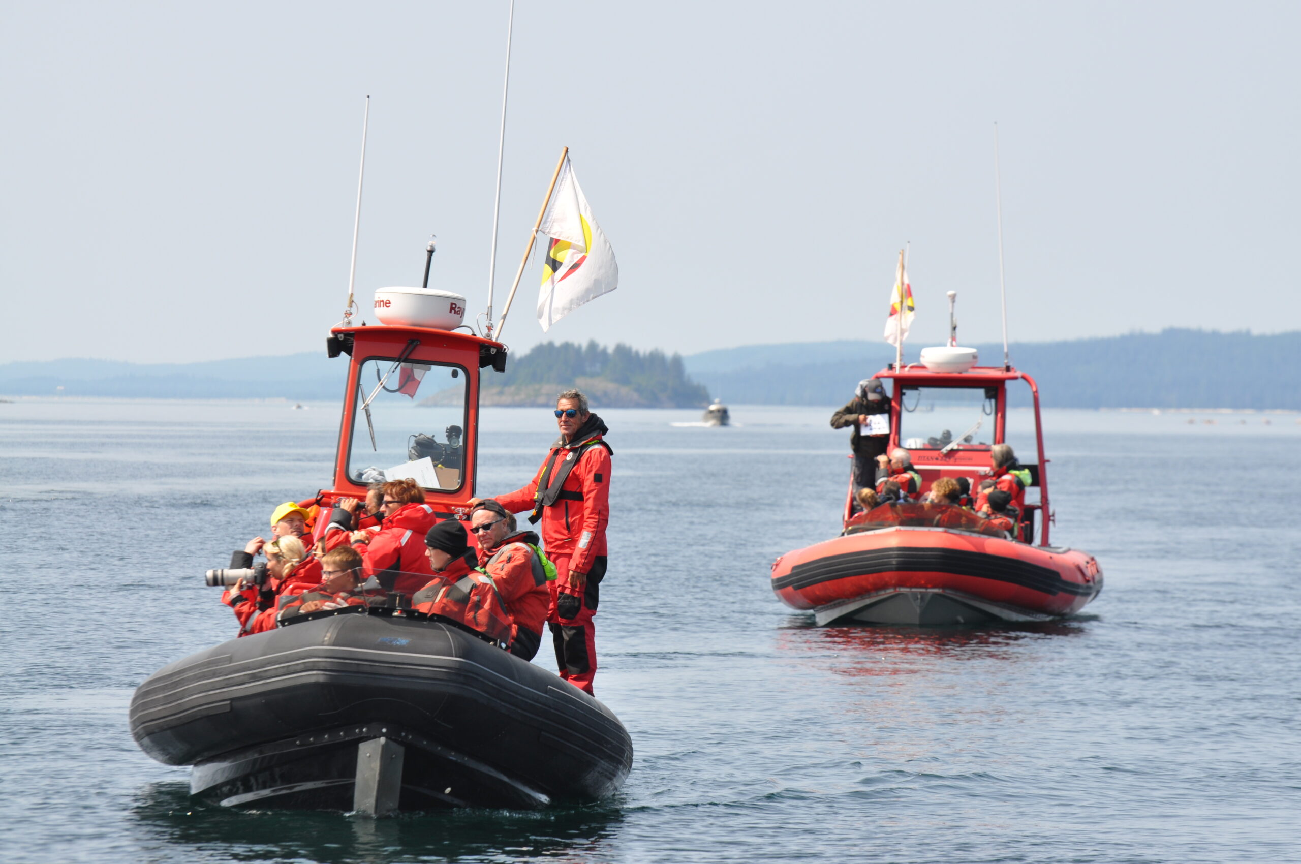 a group of people on a boat in the water